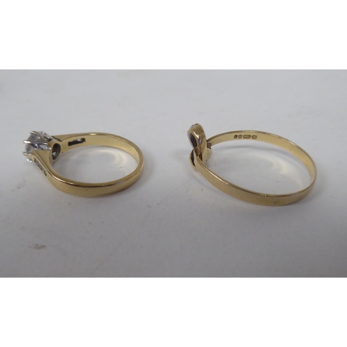 206 - Six white and gold rings, set with various stones