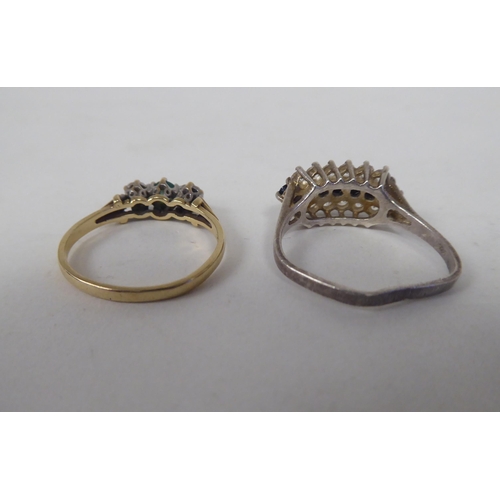 206 - Six white and gold rings, set with various stones