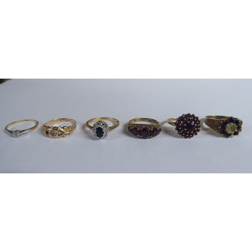 207 - Six white and gold rings, set with various stones