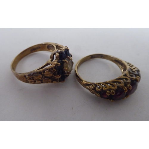 207 - Six white and gold rings, set with various stones