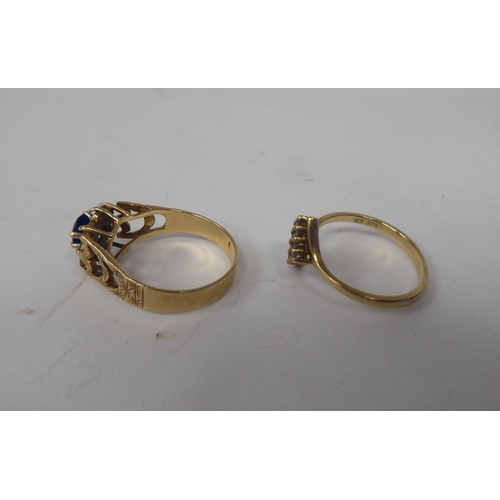 211 - Six white and gold rings, set with various stones