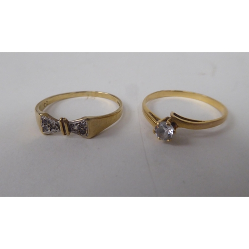 211 - Six white and gold rings, set with various stones