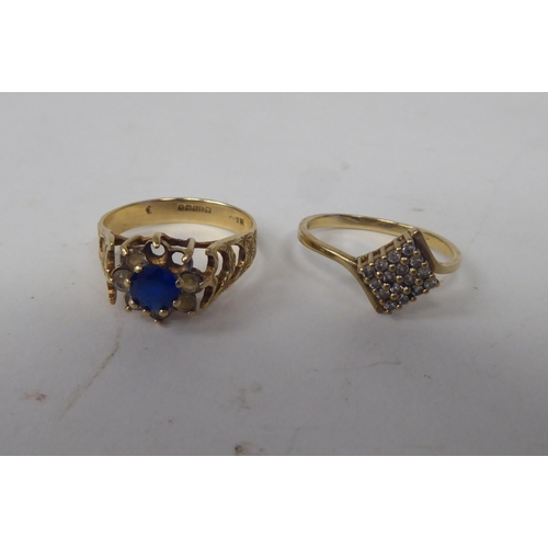 211 - Six white and gold rings, set with various stones