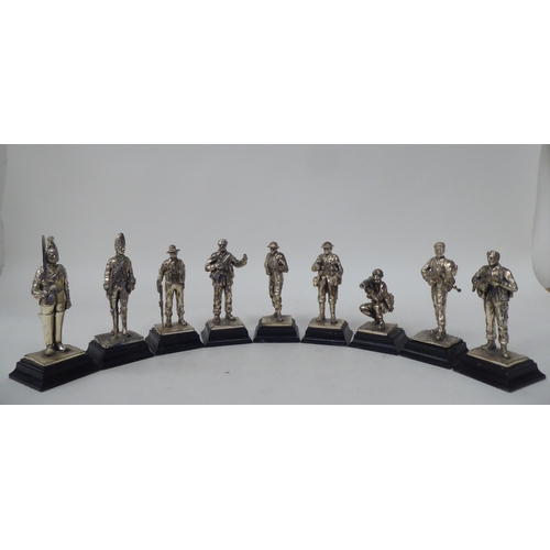 228 - A series of nine similar white metal models, British uniformed soldiers, on plinths  approx. 4.... 