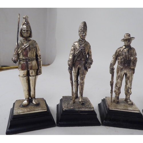 228 - A series of nine similar white metal models, British uniformed soldiers, on plinths  approx. 4.... 