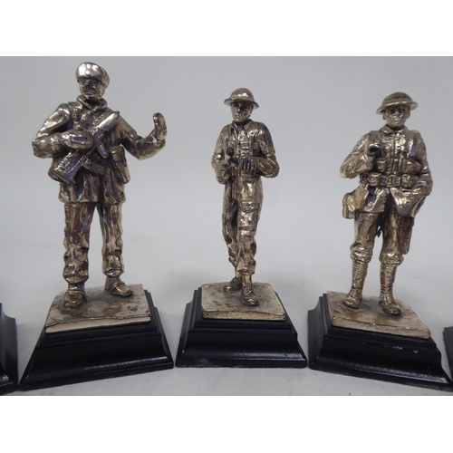 228 - A series of nine similar white metal models, British uniformed soldiers, on plinths  approx. 4.... 