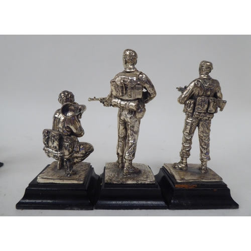 228 - A series of nine similar white metal models, British uniformed soldiers, on plinths  approx. 4.... 