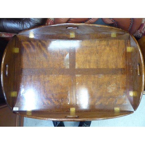 233 - A mid 20thC military design, brass hinged, mahogany tray table, the base raised on square legs ... 