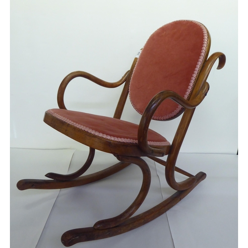 238 - A child's early 20thC stained beech framed bentwood style rocking chair