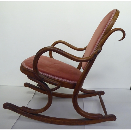 238 - A child's early 20thC stained beech framed bentwood style rocking chair