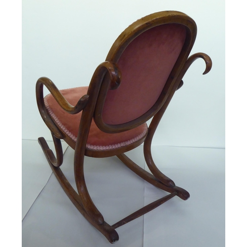 238 - A child's early 20thC stained beech framed bentwood style rocking chair