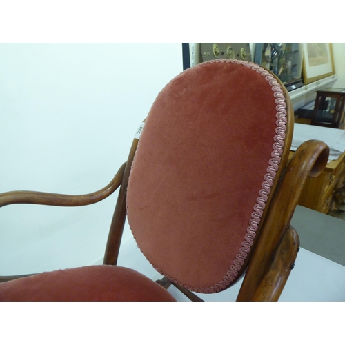 238 - A child's early 20thC stained beech framed bentwood style rocking chair