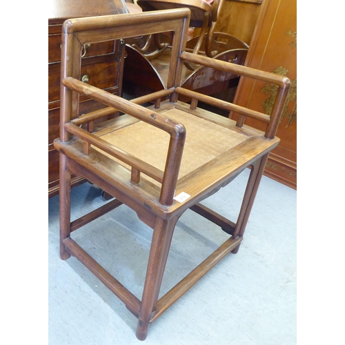 239 - A 20thC Chinese Huanghuali style fruitwood framed chair