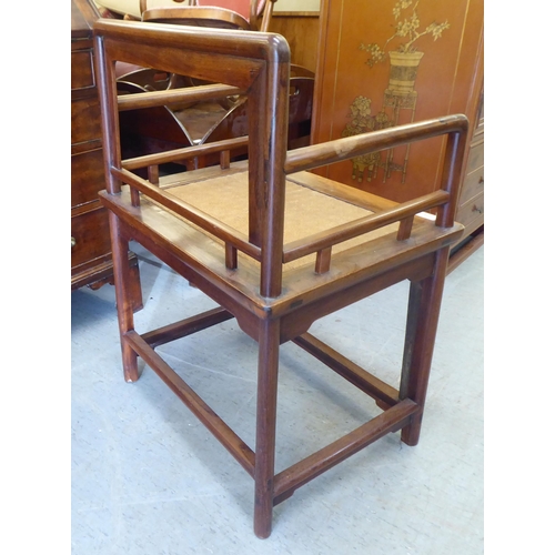 239 - A 20thC Chinese Huanghuali style fruitwood framed chair