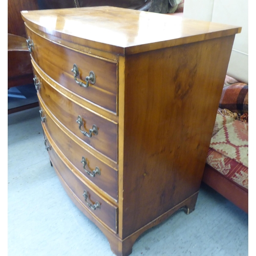 241 - A modern string inlaid yewwood bowfront, four drawer dressing chest, raised on bracket feet  32... 