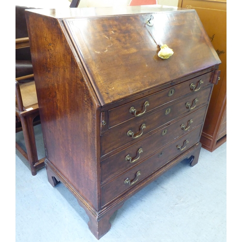 243 - A George III mahogany bureau, the fall-flap over four graduated drawers, raised on bracket feet ... 