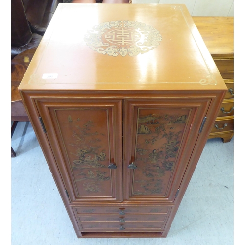 252 - A modern painted Chinese cabinet with a pair of doors, enclosing eight drawers, over three long draw... 