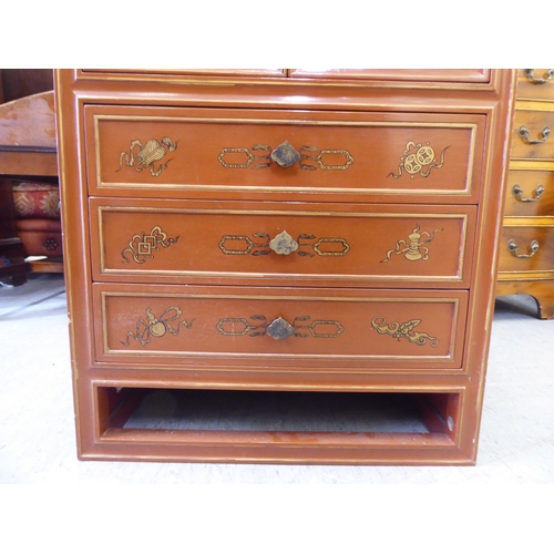 252 - A modern painted Chinese cabinet with a pair of doors, enclosing eight drawers, over three long draw... 