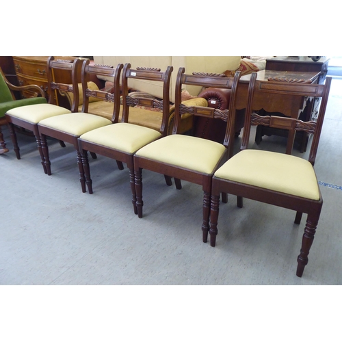 268 - A set of five William IV mahogany framed, twin bar back dining chairs, the later fabric upholstered ... 