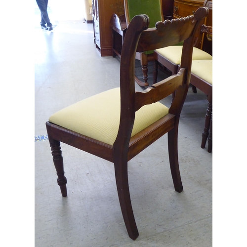 268 - A set of five William IV mahogany framed, twin bar back dining chairs, the later fabric upholstered ... 