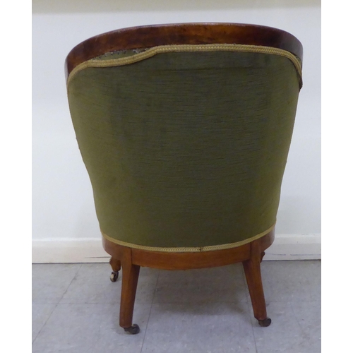 269 - A mid 19thC walnut framed salon chair with a button upholstered green fabric back, raised on cabriol... 