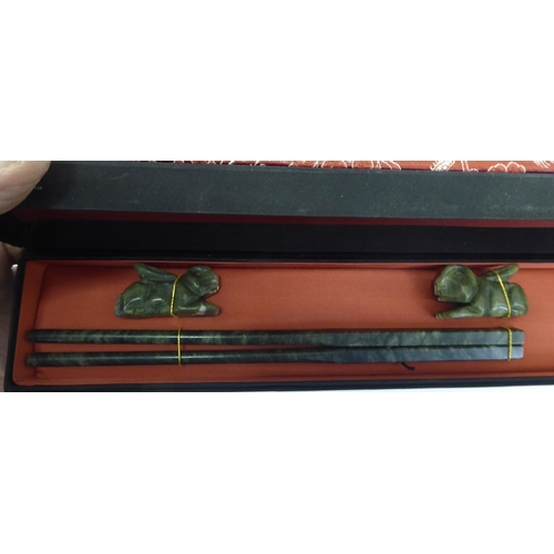 273 - Asian collectables: to include wooden stands; and two part boxes