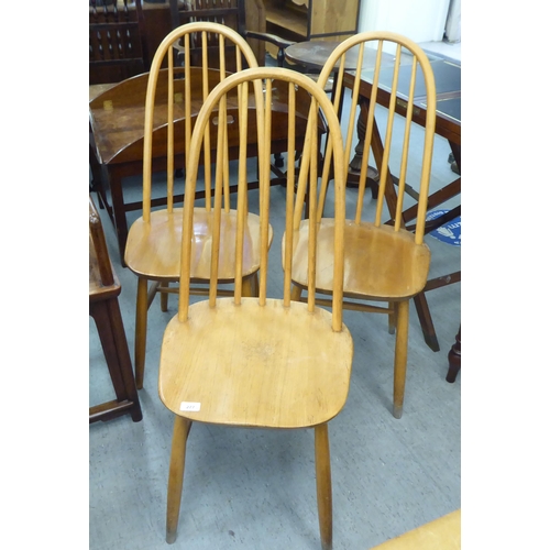 277 - Three Ercol style beech and elm framed, spindle back chairs  (no labels present)