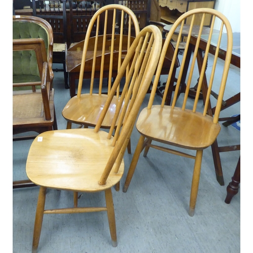 277 - Three Ercol style beech and elm framed, spindle back chairs  (no labels present)