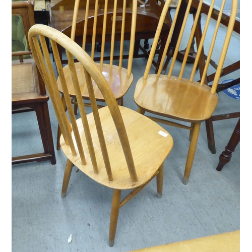 277 - Three Ercol style beech and elm framed, spindle back chairs  (no labels present)