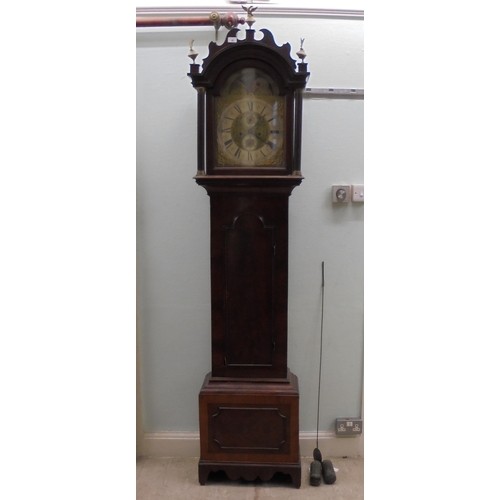 279 - A late 18thC mahogany longcase clock, the arched fretworked hood and glazed window, between reeded f... 