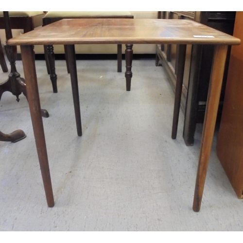 287 - A Farum, Made in Denmark, rosewood lamp table, model no.9840, raised on turned, tapered legs  1... 