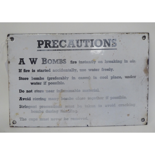 289 - A World War II black on white enamelled steel sign for 'Precautions connected with the handling and ... 