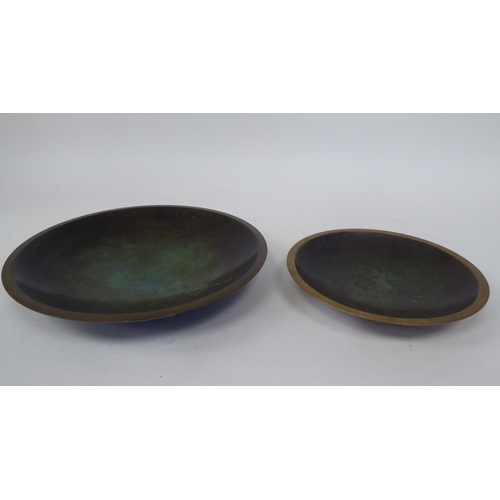 294 - A Just Anderson part-patinated green and brown bronze, footed, shallow dish with a double tramline e... 