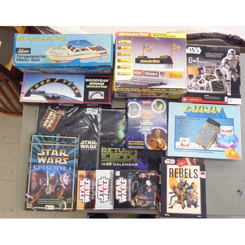 306 - Toys: to include a Schuco Samara II Ferngesteuettes Elektro-Boot; and a Scalextric pole position sou... 