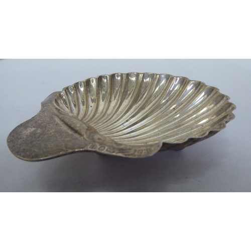 307 - Silver and white metal collectables: to include a scallop shape butter dish  London marks rubbe... 