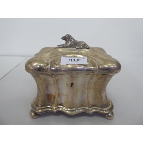 312 - A late 19thC Continental white metal, lockable tea casket, the lid surmounted by a dog  5