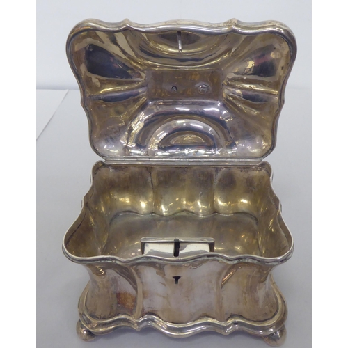 312 - A late 19thC Continental white metal, lockable tea casket, the lid surmounted by a dog  5