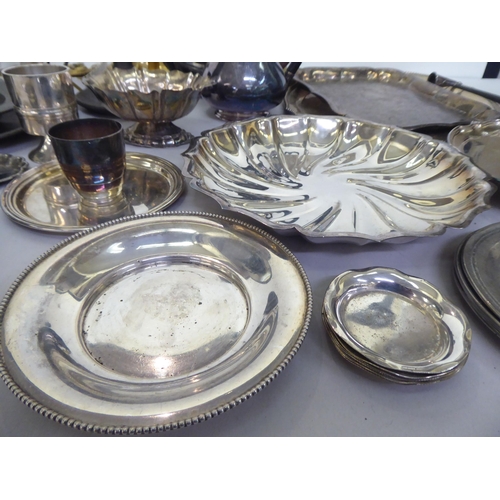 314 - Metalware: to include a silver plated tray of oval form with a bead edge  12