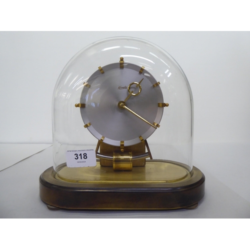 318 - A Kundo Electromagnetic mantel clock; the exposed movement faced by a baton dial  9