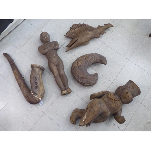 326 - Five wooden carvings: to include a saxophone  25