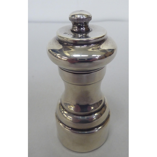 329 - A silver pepper mill of traditional design  London marks rubbed