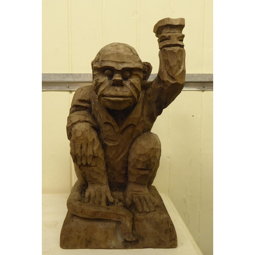 331 - A carved wooden figure, a monkey posing as a waiter  18