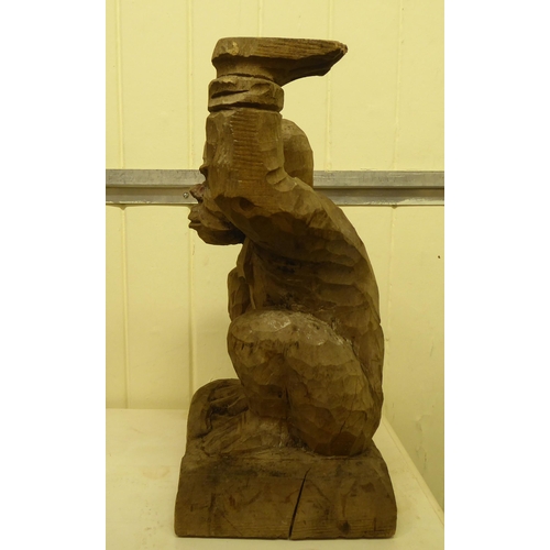 331 - A carved wooden figure, a monkey posing as a waiter  18