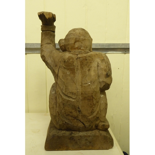 331 - A carved wooden figure, a monkey posing as a waiter  18