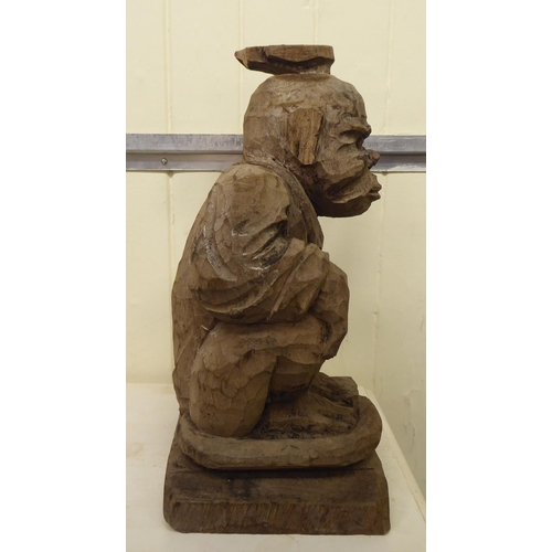 331 - A carved wooden figure, a monkey posing as a waiter  18