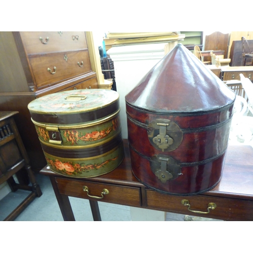 332 - Two dissimilar painted tinplate and other hat boxes  largest 18