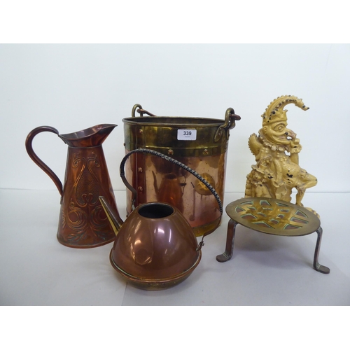 339 - Metalware: to include an early 20thC Beldray copper jug, decorated with flora  10