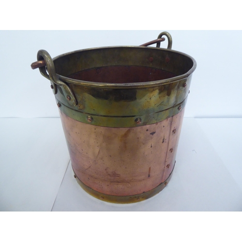 339 - Metalware: to include an early 20thC Beldray copper jug, decorated with flora  10