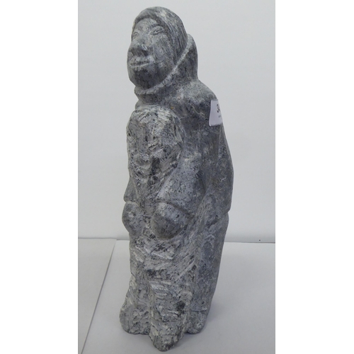 343 - Carved figures: to include a hardstone Inuit mother and child  11.5