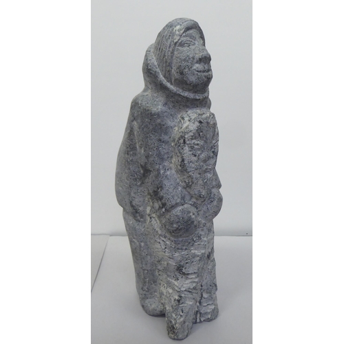 343 - Carved figures: to include a hardstone Inuit mother and child  11.5